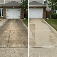 Before and after driveway pressure washing in Akron, OH - showing removal of cracks and stains
