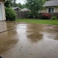Pressure washing in progress on concrete driveway in Fairlawn, OH